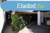 Elad csaldi hz Komdi kzpont